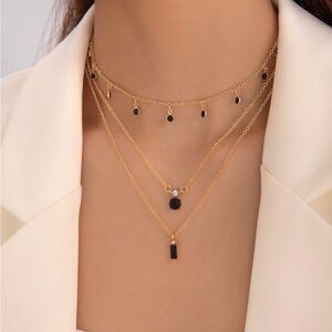 Elegant Gold and Black Layered Necklace